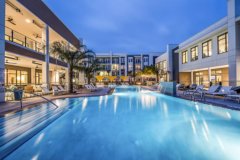 Resort-style pool with cabanas at Presidium Regal Apartments