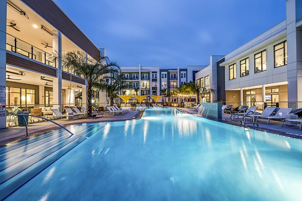 Resort-style pool with cabanas at Presidium Regal Apartments