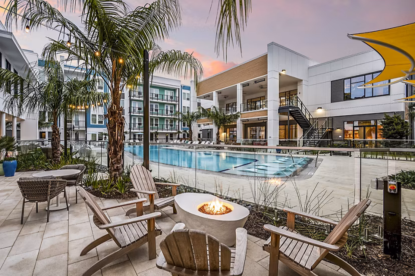 Fire pit near a luxury pool at Presidium Regal Apartments, offering a cozy outdoor gathering space
