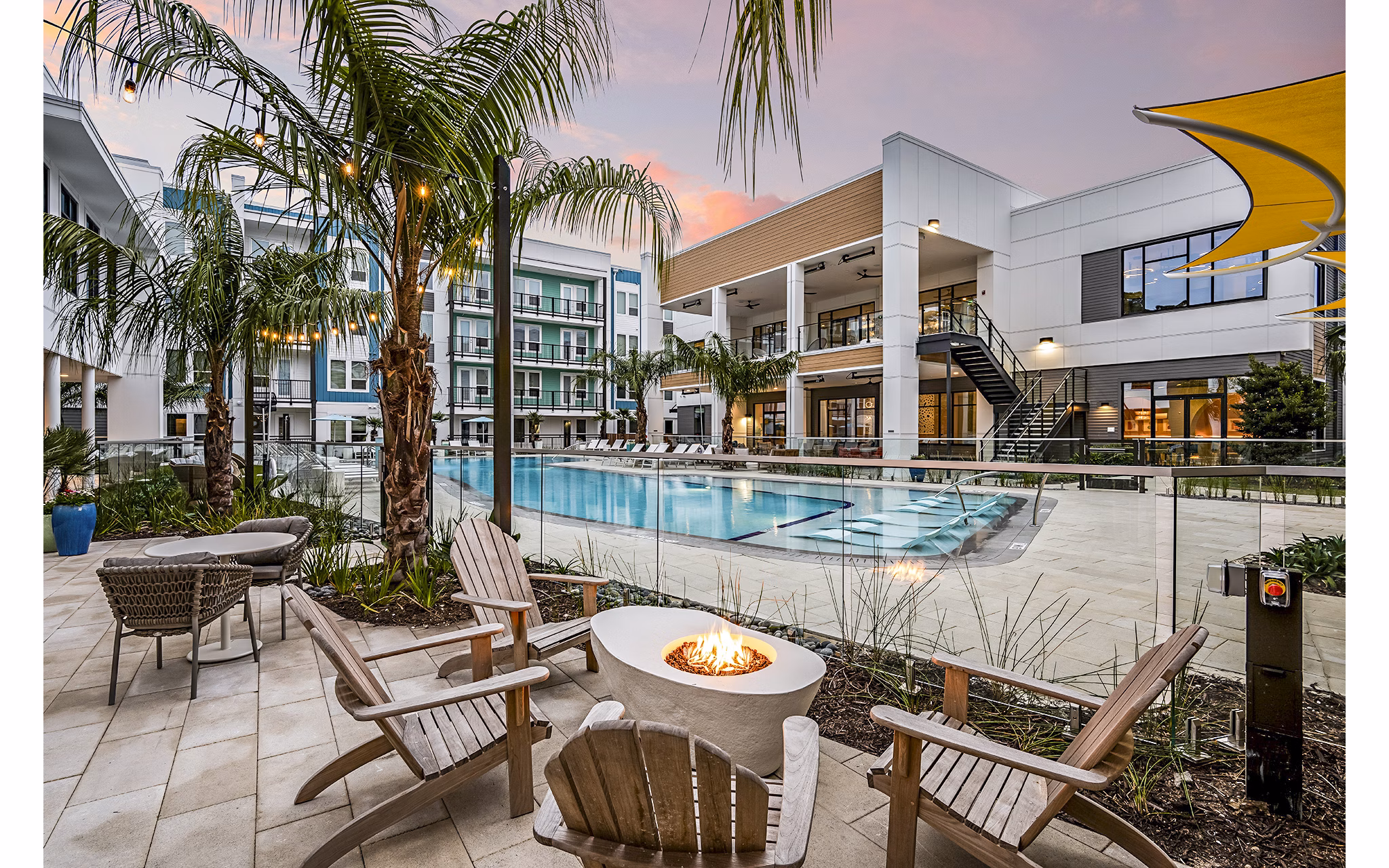 Fire pit near a luxury pool at Presidium Regal Apartments, offering a cozy outdoor gathering space