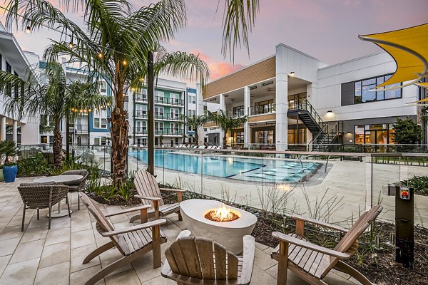 Fire pit near a luxury pool at Presidium Regal Apartments, offering a cozy outdoor gathering space