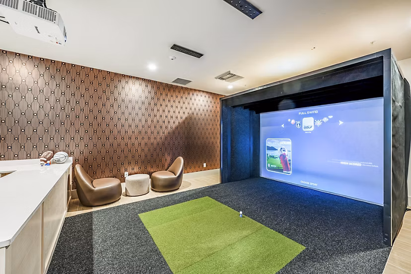 Virtual driving range at Presidium Regal Apartments offers state-of-the-art golf simulation technology for residents to practice and enhance their swing