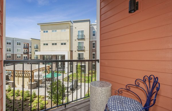 Patio balcony with stylish outdoor seating at The Westlyn Apartments offering urban living experience in a prime location
