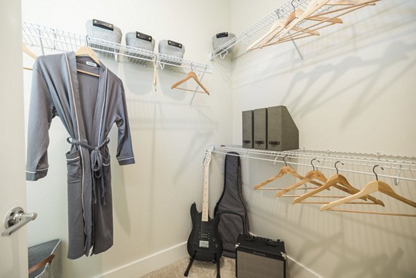 Spacious closet with built-in shelving in Riverwood Apartments