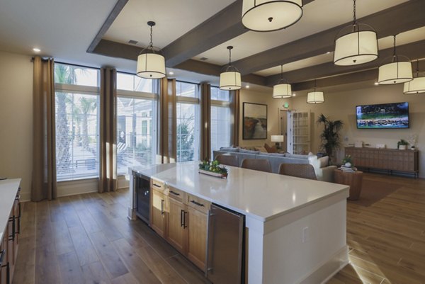 Riverwood Apartments: Stylish clubhouse with modern decor and seating areas