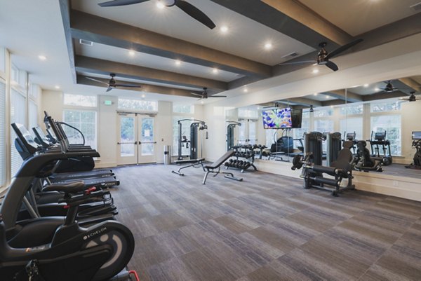 State-of-the-art fitness center featuring modern gym equipment at Riverwood Apartments