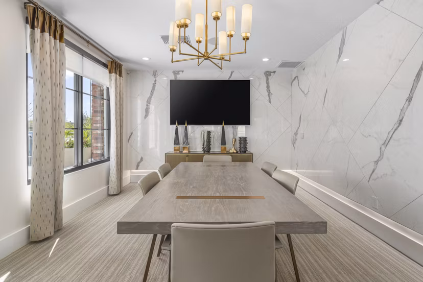 Modern meeting facility at The Griffin Apartments with state-of-the-art audiovisual equipment for residents' convenience