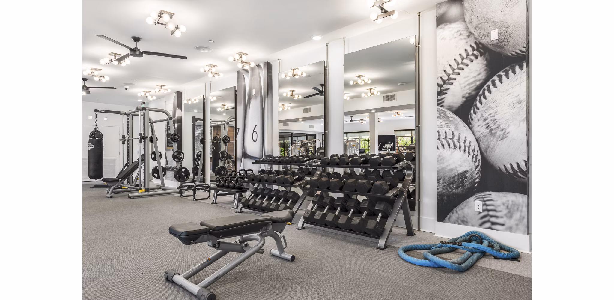State-of-the-art fitness center with modern equipment at The Griffin Apartments, a luxury Greystar community
