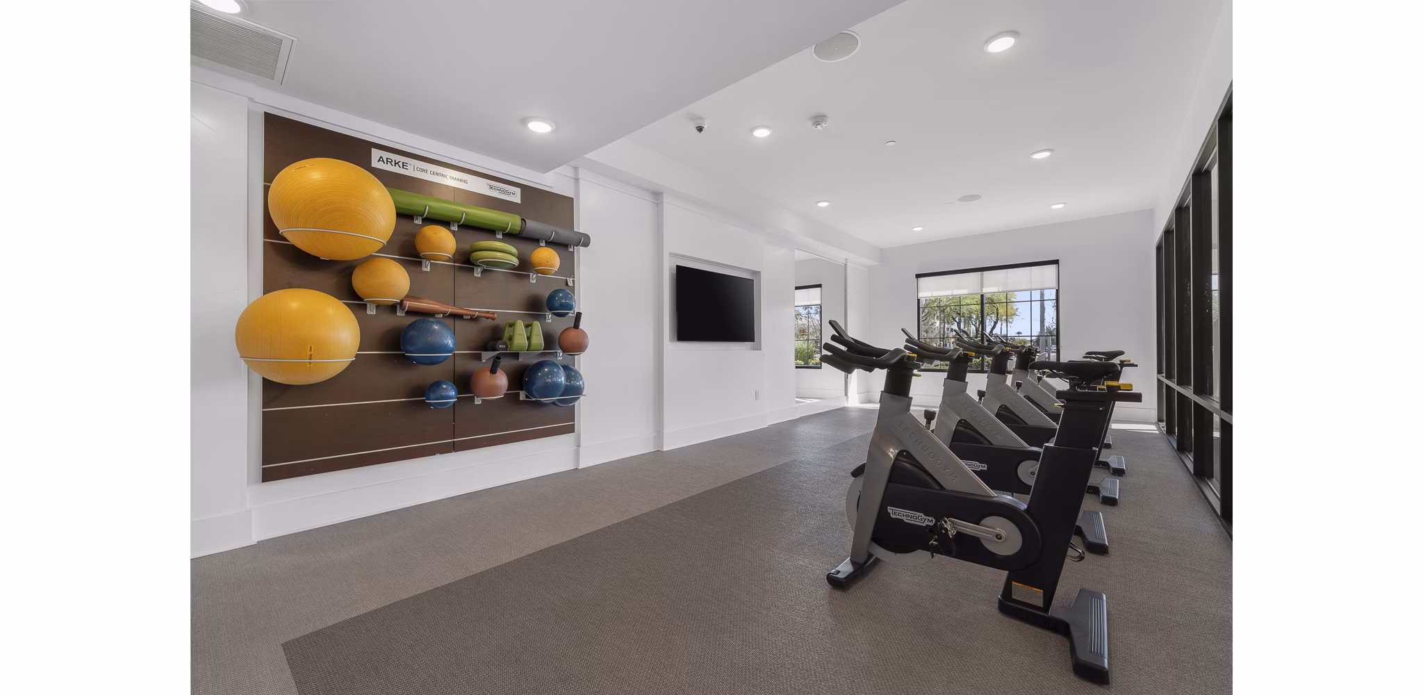 Yoga and spin studio with modern equipment at The Griffin Apartments