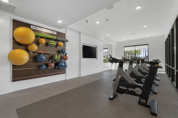 Yoga and spin studio with modern equipment at The Griffin Apartments