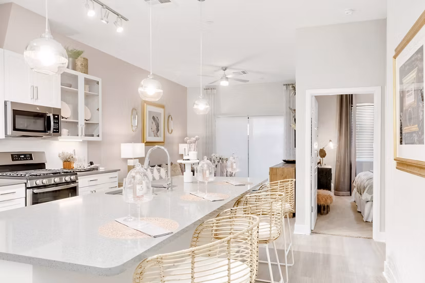 Modern kitchen with stainless steel appliances at The Griffin Apartments, luxury residence by Greystar