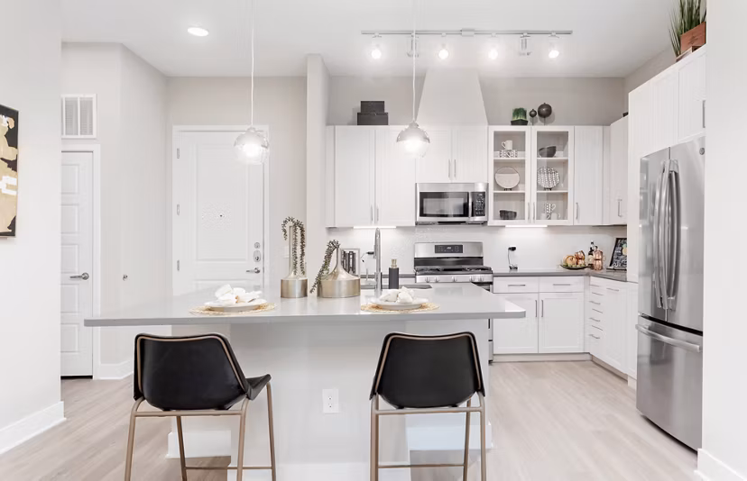 Kitchen with modern appliances and sleek countertops at The Griffin Apartments