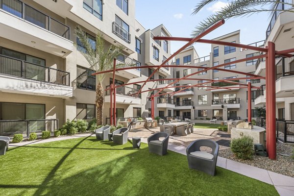 The Griffin Apartments: Peaceful courtyard with lush landscaping for relaxation and community gatherings in the heart of the city