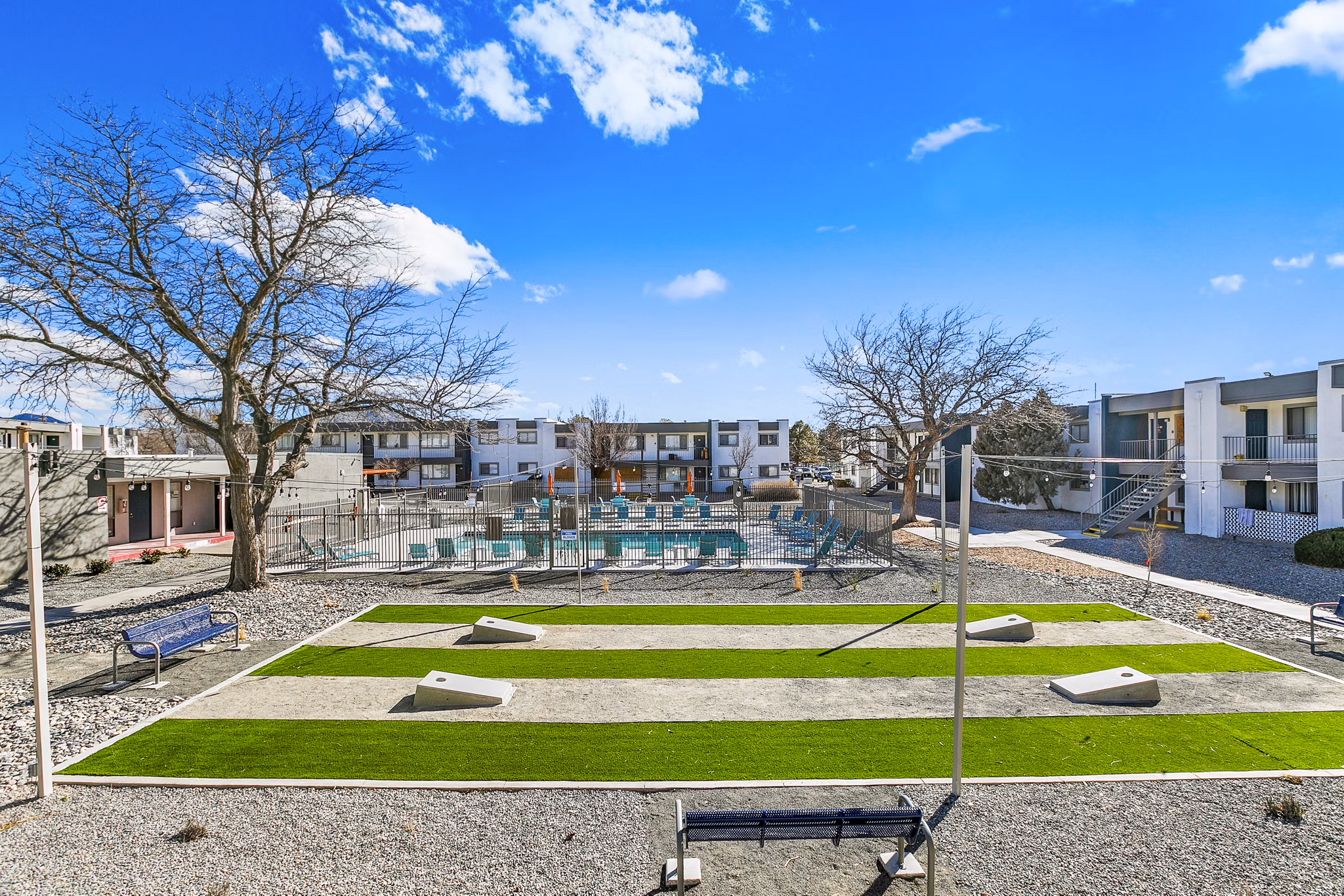 Modern recreational area with cozy seating and greenery at Tesota Four Hills Apartments