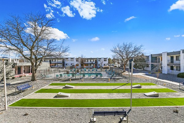 Modern recreational area with cozy seating and greenery at Tesota Four Hills Apartments