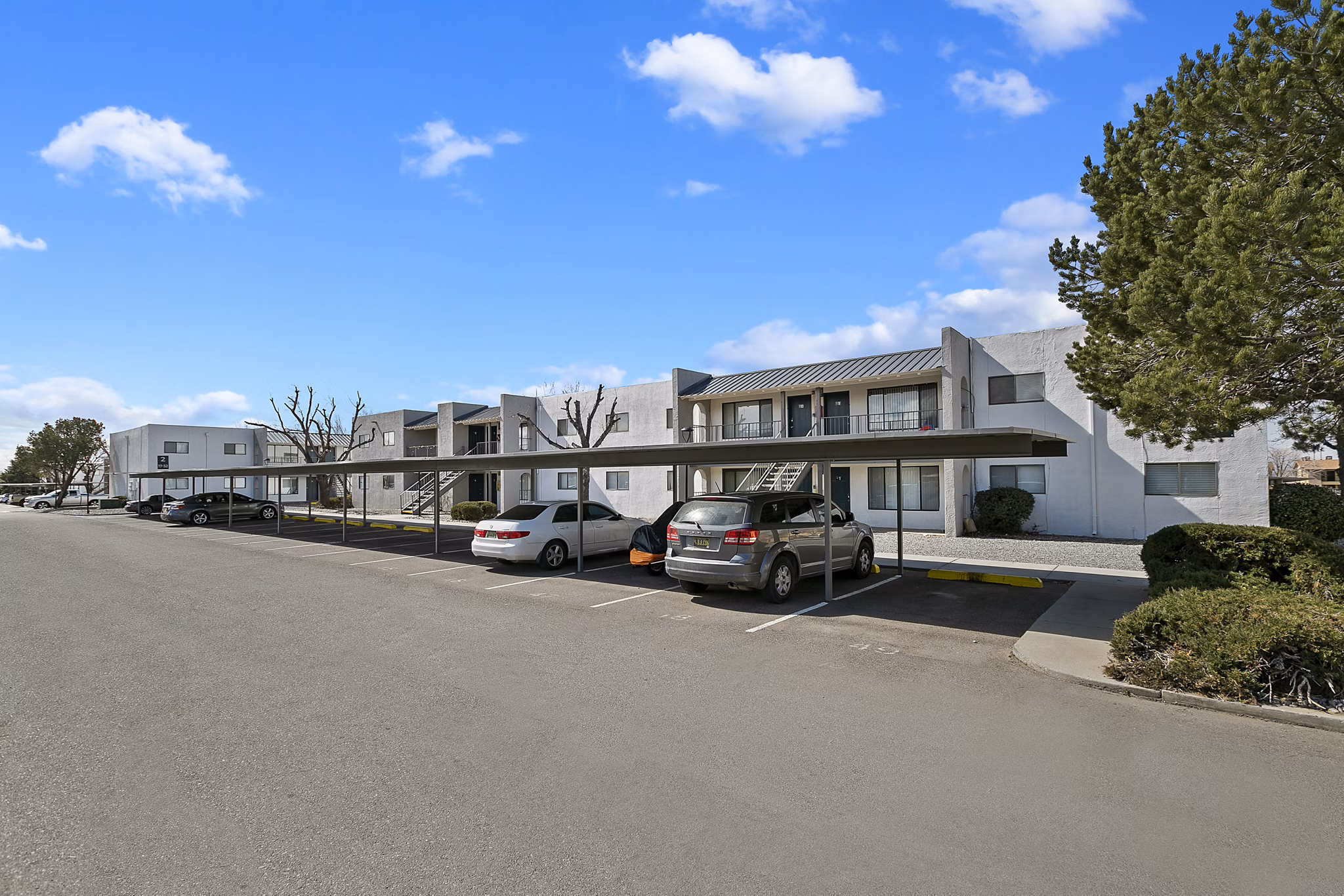 Covered parking facility at Tesota Midtown Apartments: secure parking for residents with convenient access in our luxury Tucson location