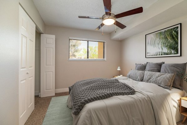 Elegant bedroom with modern furnishings at Tesota Midtown Apartments