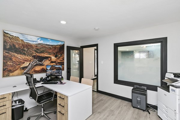 Clubhouse featuring modern seating and entertainment options at Tesota Midtown Apartments