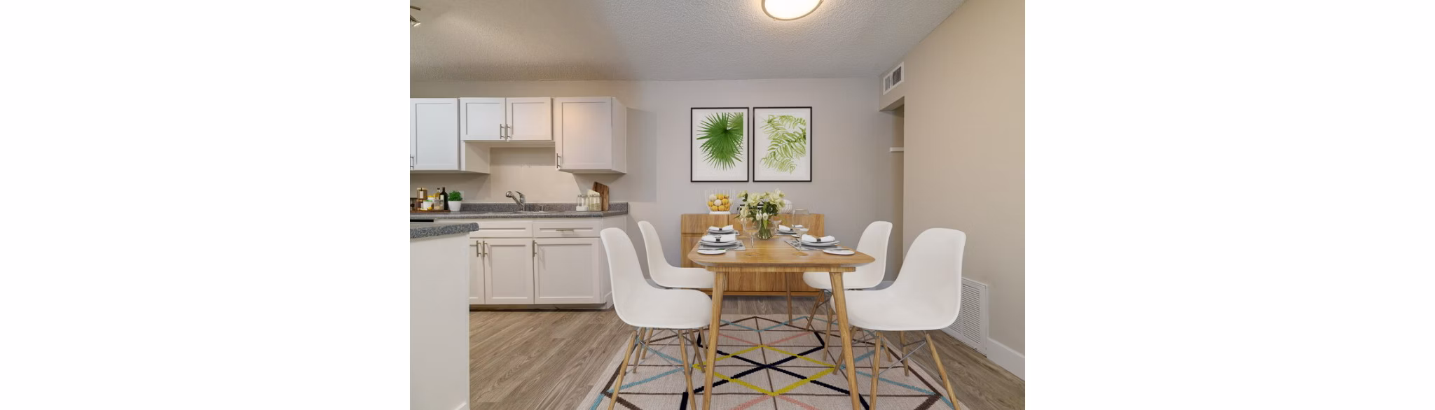 Elegant dining area with modern decor at Tesota Midtown Apartments