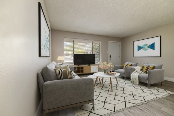 Spacious living room with sleek modern decor at Prado Apartments luxury community