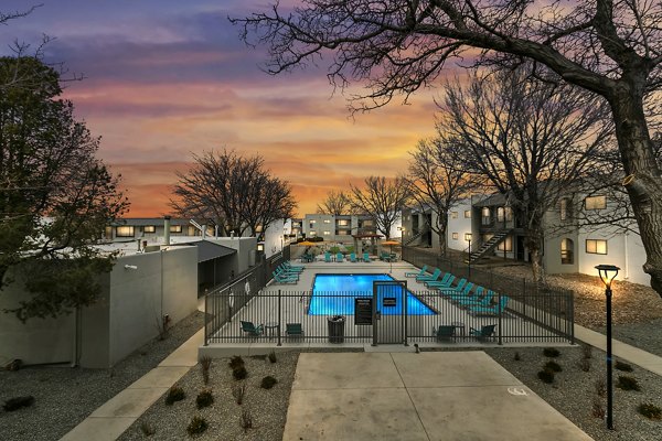 Sparkling pool at Tesota Midtown Apartments with relaxing sun loungers nearby