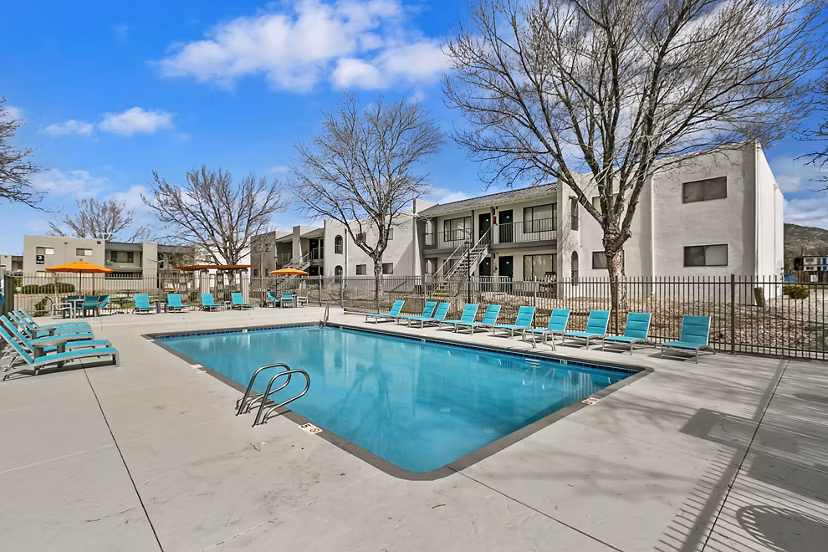 Tesota Midtown Apartments: Sunlit outdoor pool with modern lounge chairs