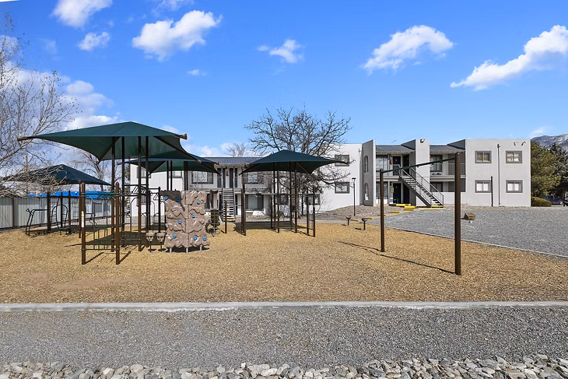 Playground with modern equipment at Tesota Midtown Apartments for family-friendly recreation
