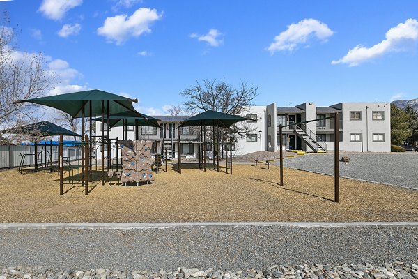 Playground with modern equipment at Tesota Midtown Apartments for family-friendly recreation