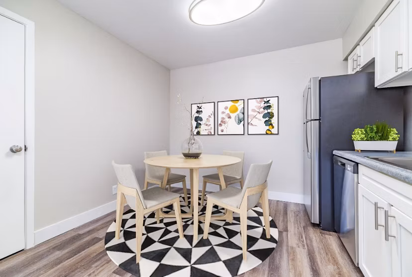 Dining room with modern decor and elegant lighting at Tesota Morningside Apartments