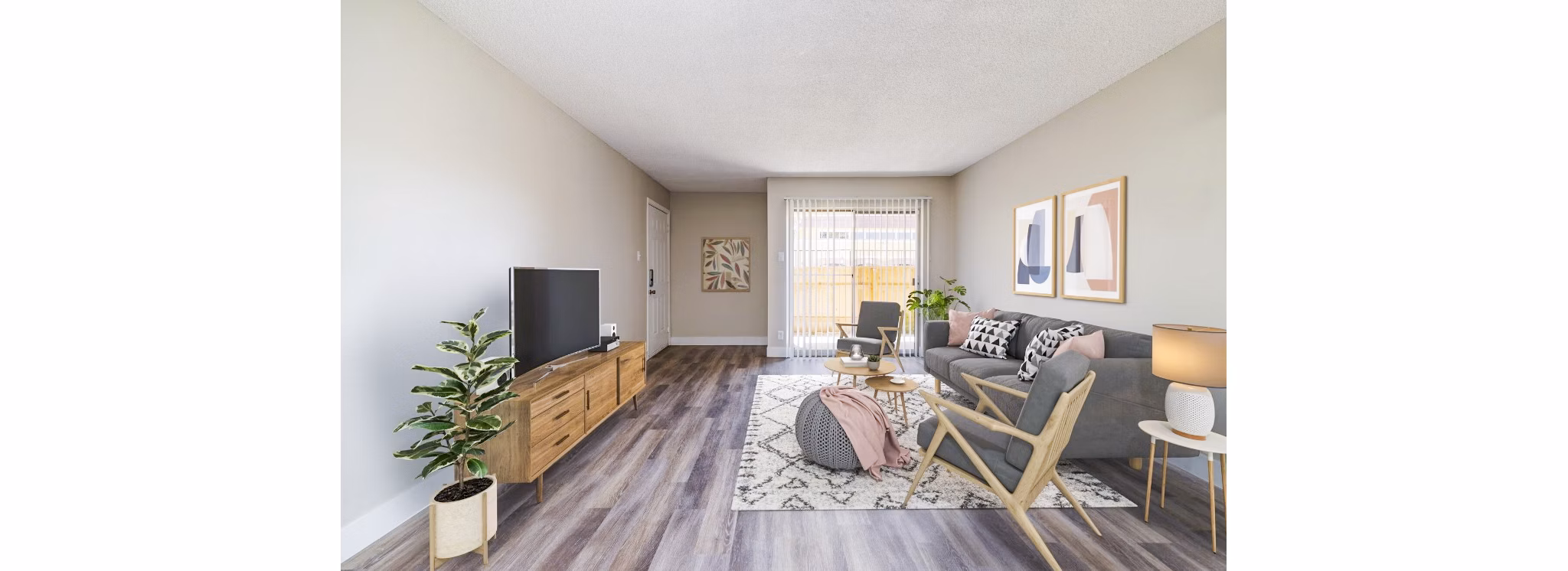 Spacious living room with modern decor and large windows in Tesota Morningside Apartments