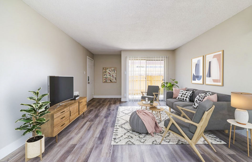 Spacious living room with modern decor and large windows in Tesota Morningside Apartments