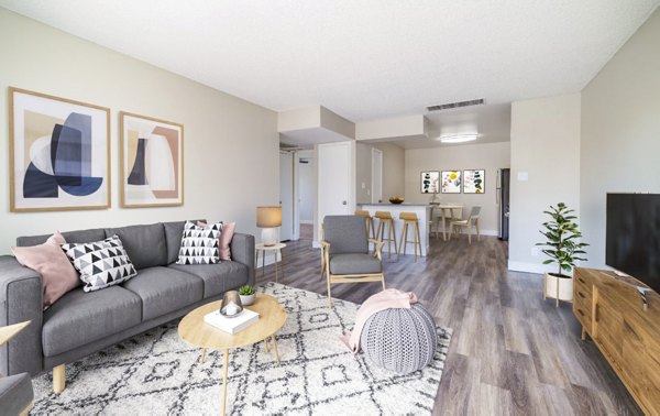 Spacious living room with contemporary decor in Tesota Morningside Apartments, offering luxury lifestyle and comfort