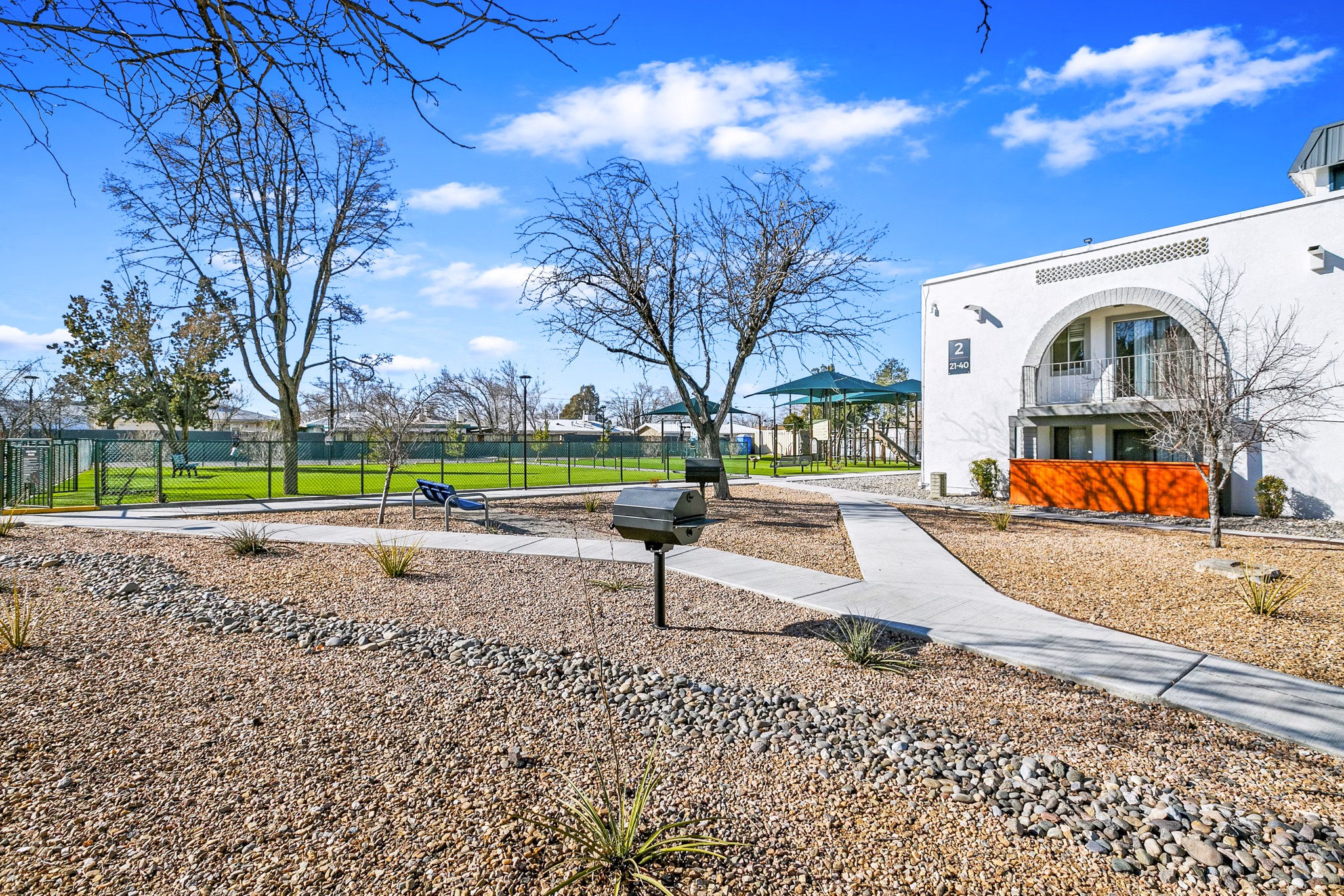 Inviting grill area on patio at Tesota Morningside Apartments, perfect for outdoor dining in a luxurious setting