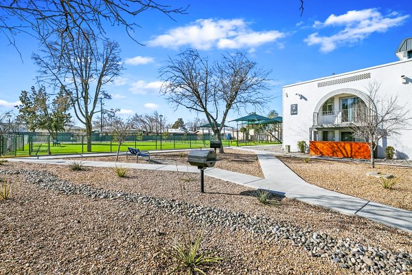 Inviting grill area on patio at Tesota Morningside Apartments, perfect for outdoor dining in a luxurious setting