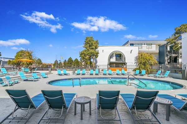 Tesota Morningside Apartments: Inviting pool area featuring loungers and landscaped surroundings