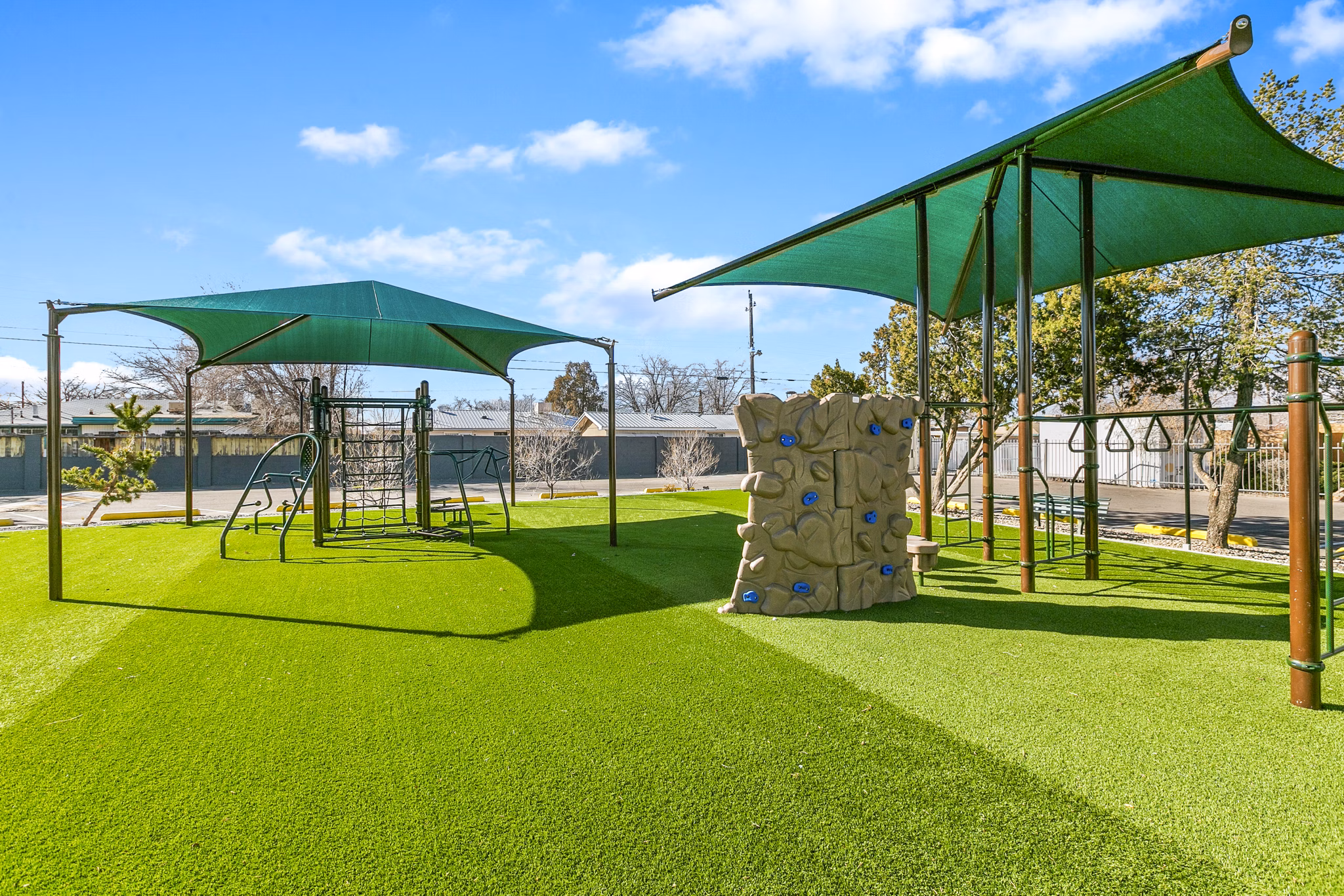 Colorful playground at Tesota Morningside Apartments offering family-friendly recreation in a luxurious setting