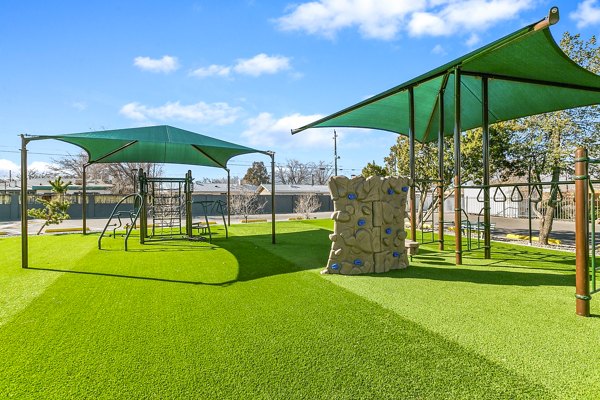 Colorful playground at Tesota Morningside Apartments offering family-friendly recreation in a luxurious setting