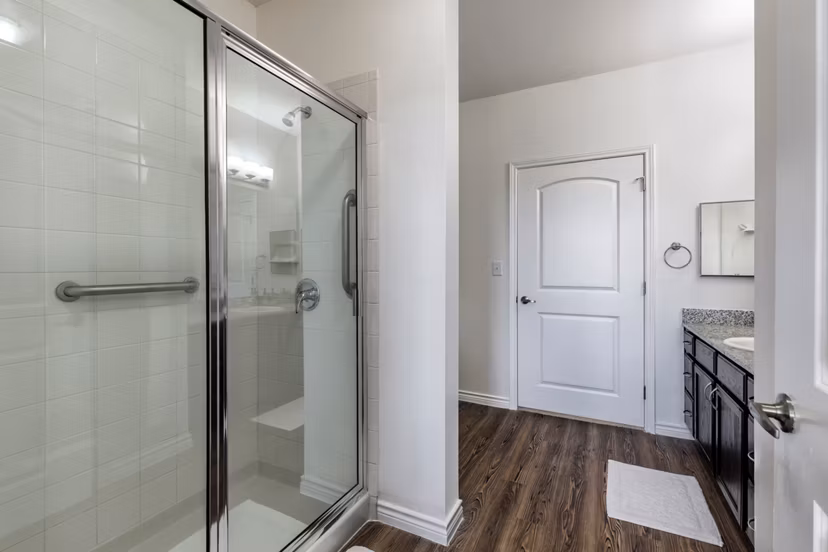 Luxurious bathroom featuring double vanity and elegant finishes at Aviva Fort Worth Apartments