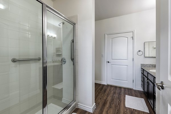 Luxurious bathroom featuring double vanity and elegant finishes at Aviva Fort Worth Apartments