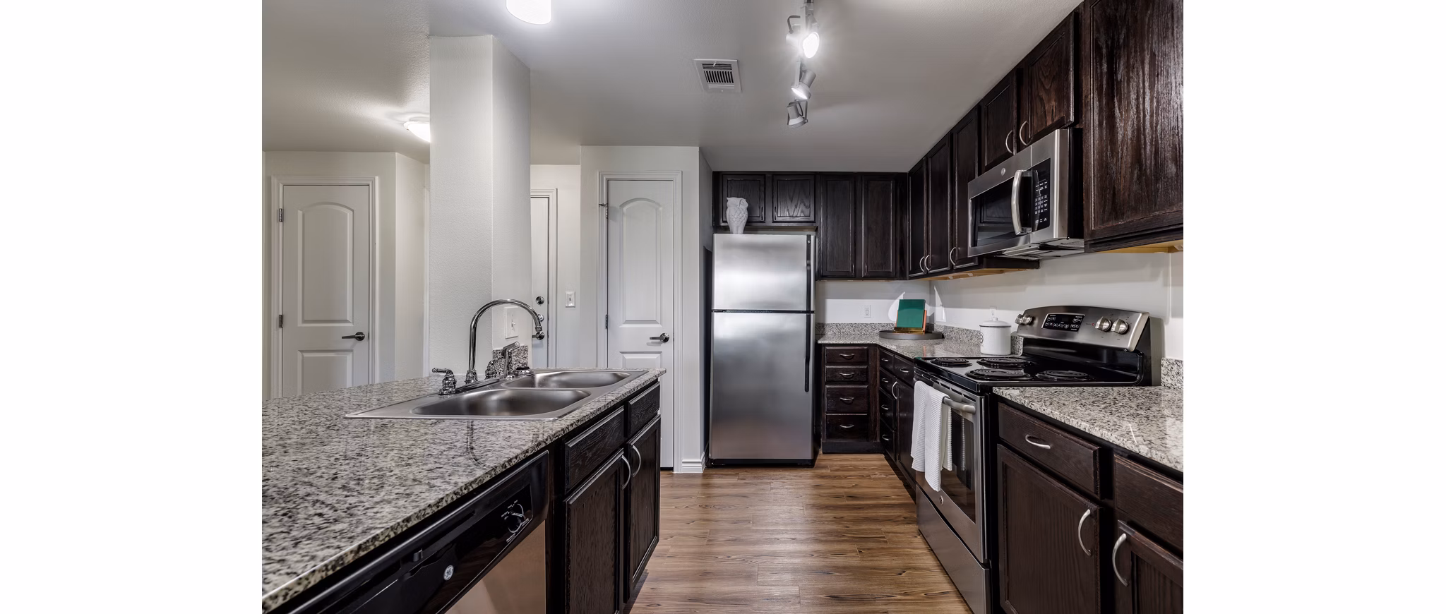 Modern kitchen with stainless steel appliances at Aviva Fort Worth Apartments
