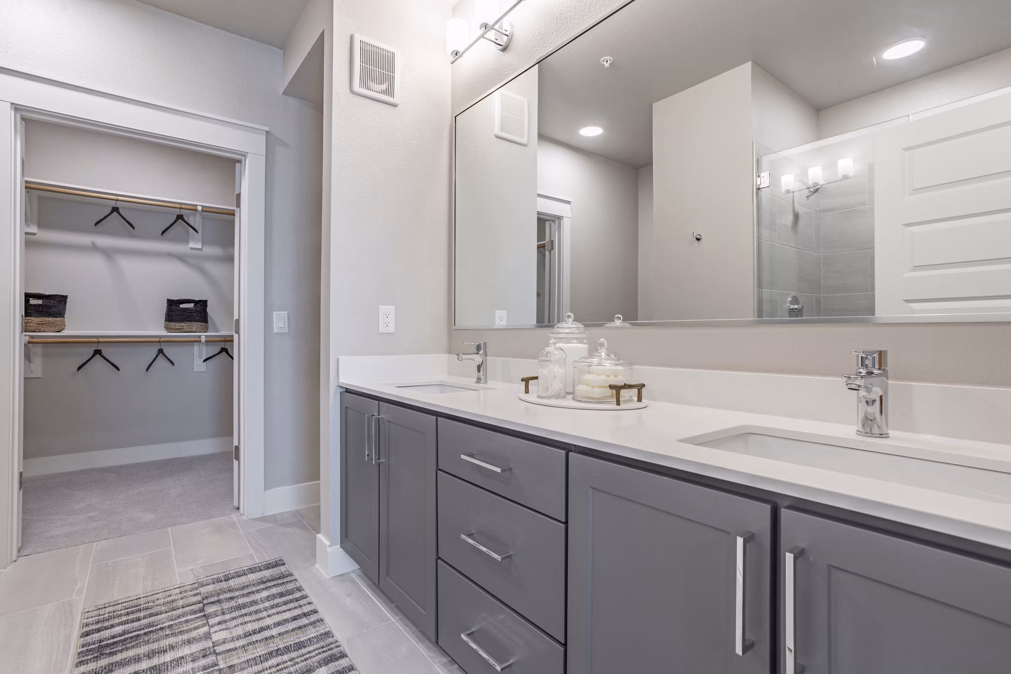 Modern bathroom featuring sleek fixtures and bright lighting at Filament Apartments