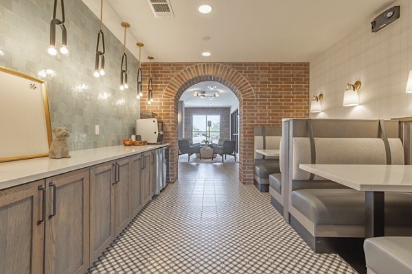 Clubhouse featuring modern seating and entertainment options at Filament Apartments