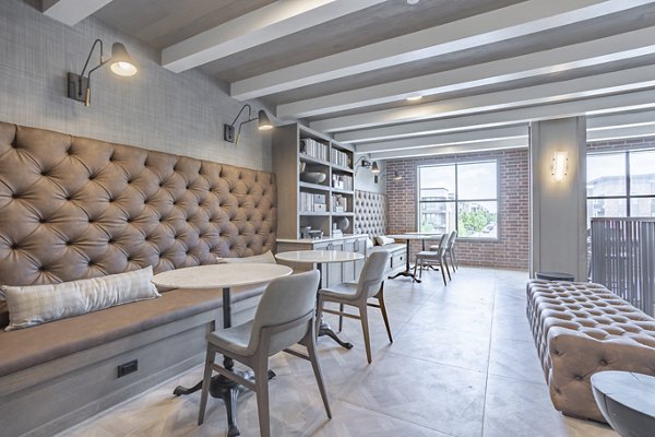 Clubhouse featuring modern decor and communal seating at Filament Apartments