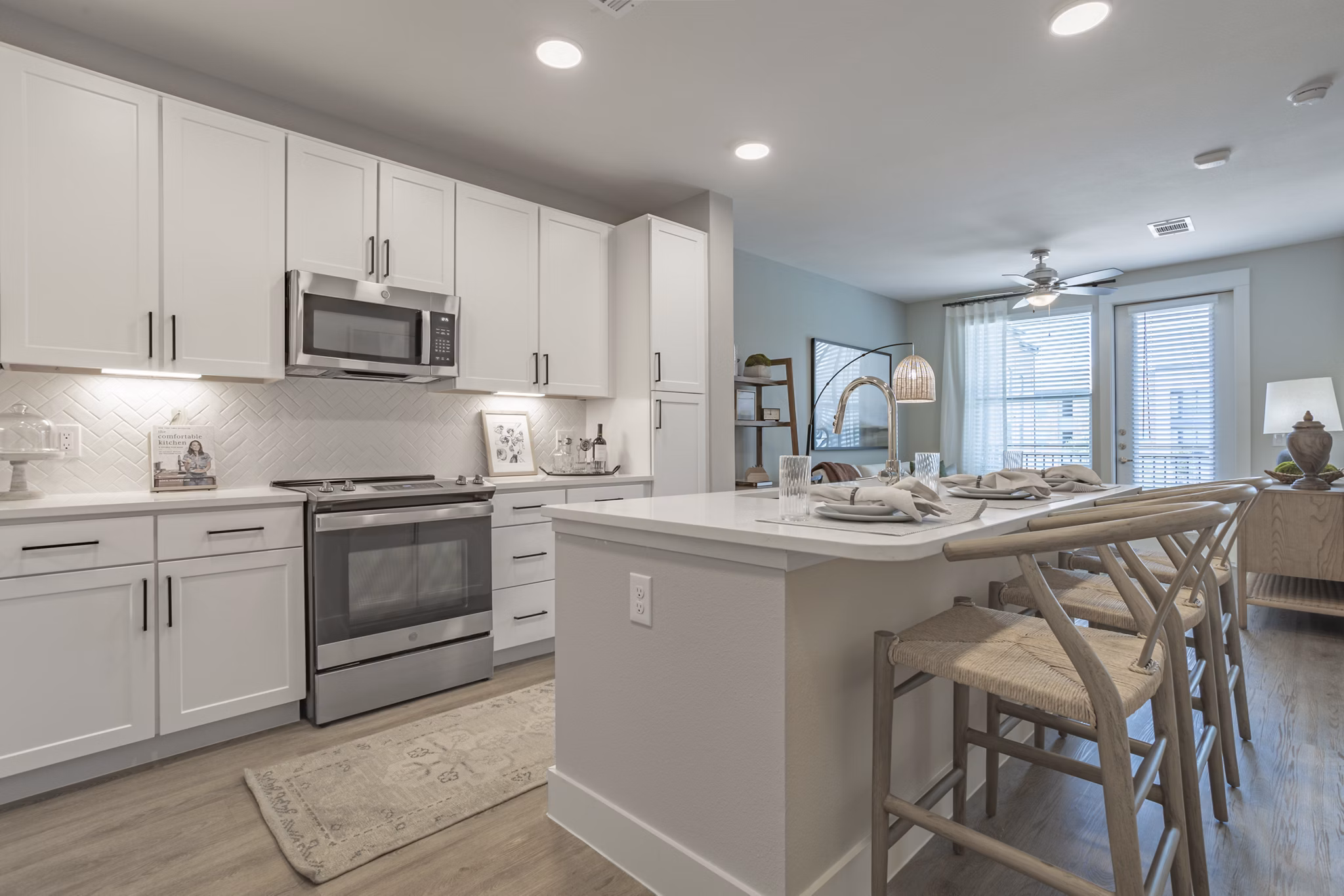 Modern kitchen with stainless steel appliances at Filament Apartments, luxury apartments by Greystar