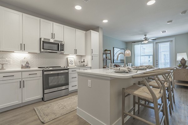 Modern kitchen with stainless steel appliances at Filament Apartments, luxury apartments by Greystar