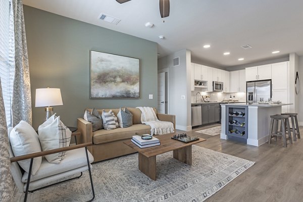 Contemporary living room with chic decor at Filament Apartments, offering luxury amenities and spacious layouts