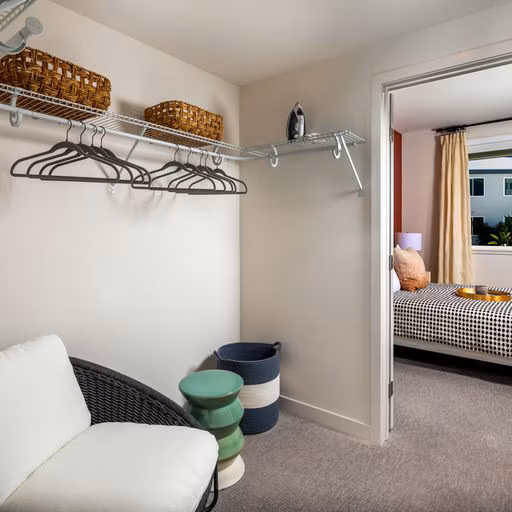 Spacious closet with built-in shelving in Paloma Apartments