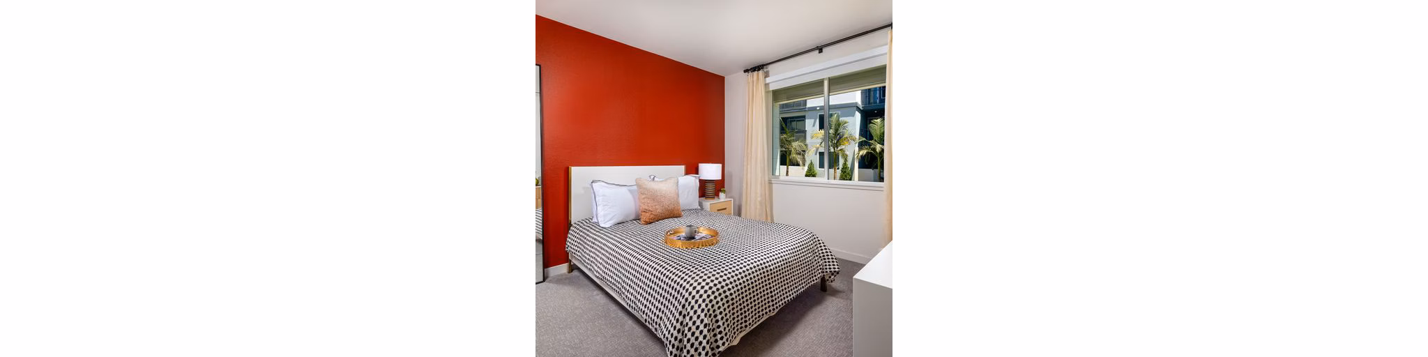 Cozy bedroom with modern decor at Paloma Apartments, featuring luxury fittings and natural light for a serene living experience
