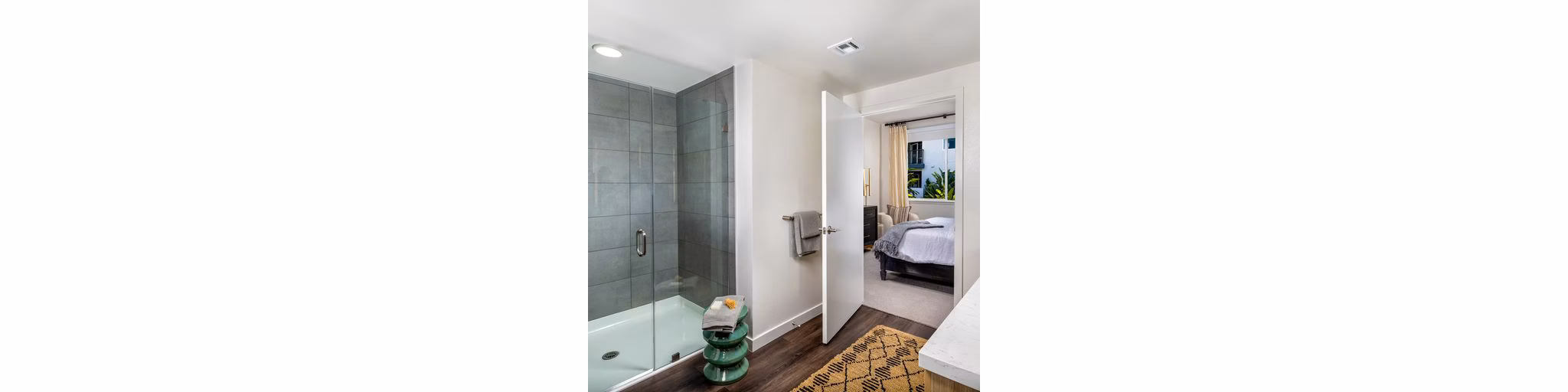 Modern bathroom featuring sleek fixtures and tiled shower in Paloma Apartments