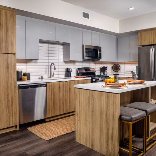 Modern kitchen with sleek countertops and stainless steel appliances in Paloma Apartments